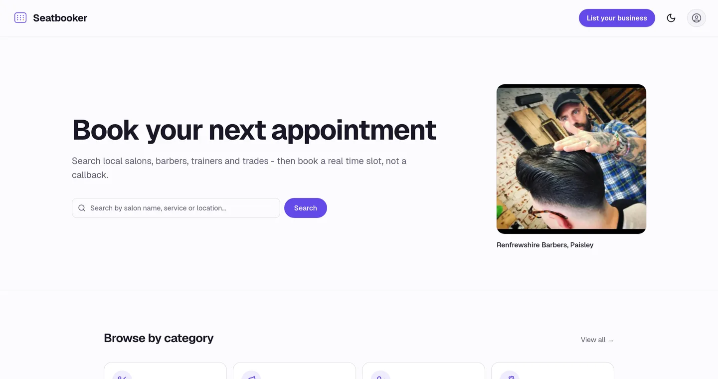 The Seatbooker home page, showing a search box for salons, barbers and trainers next to a photograph of a barber at work.